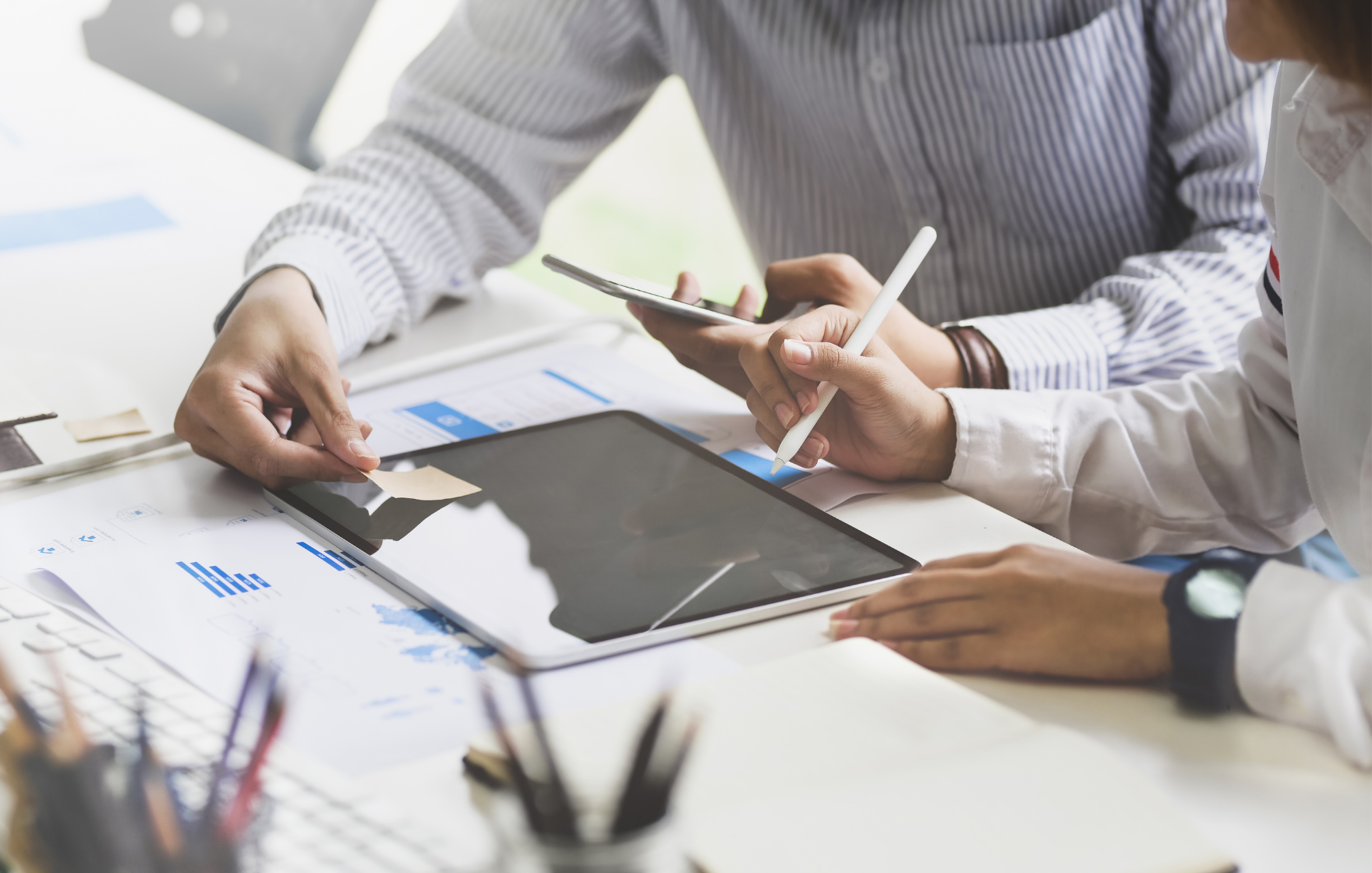 two men sitting and discussing the advantages of cash flow forecasts